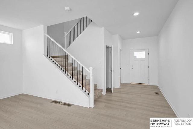 foyer with light hardwood / wood-style floors