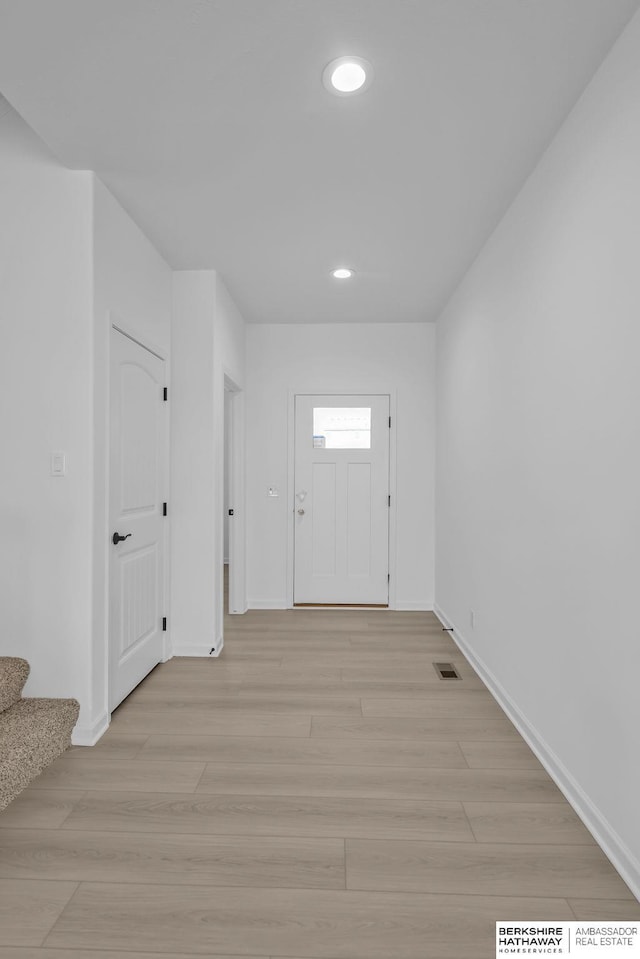 entryway with light hardwood / wood-style flooring