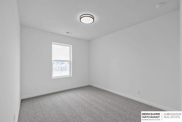 unfurnished room featuring carpet