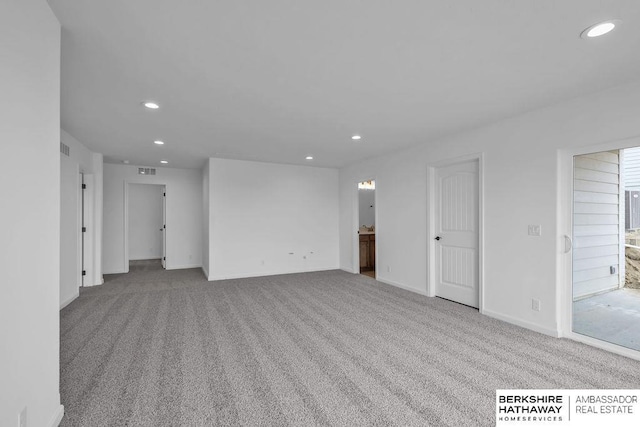 unfurnished room with light colored carpet