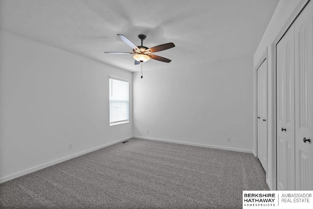 unfurnished bedroom featuring ceiling fan, carpet floors, and a closet