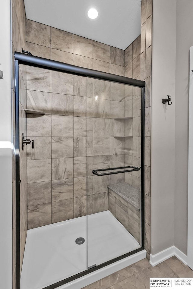 bathroom featuring an enclosed shower