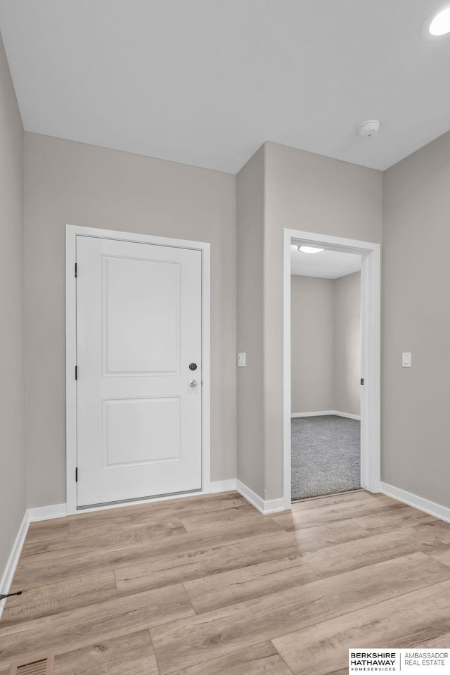 unfurnished room featuring light hardwood / wood-style floors