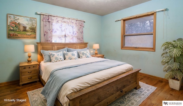 bedroom featuring wood-type flooring