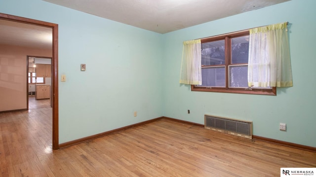 spare room with light hardwood / wood-style floors