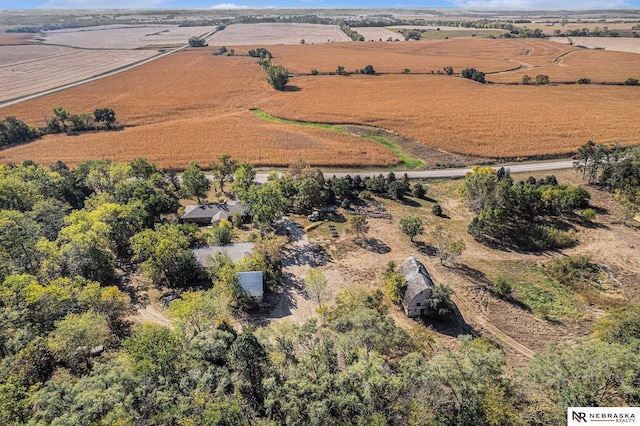 birds eye view of property with a rural view