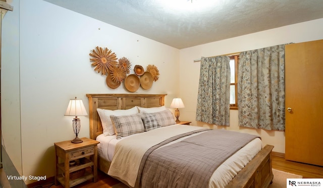 bedroom featuring hardwood / wood-style flooring