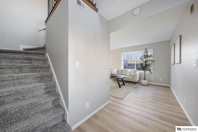 stairway with wood-type flooring