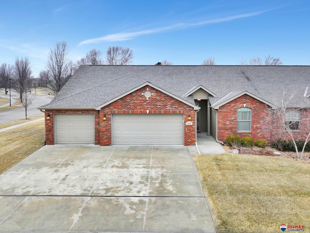 ranch-style house with a garage and a front yard