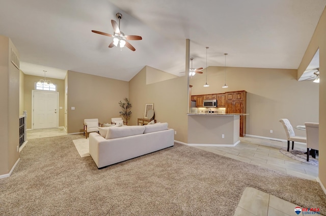 living room featuring light carpet, ceiling fan with notable chandelier, and high vaulted ceiling