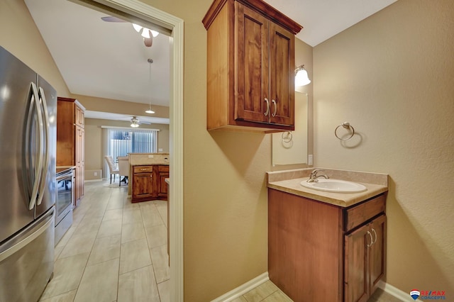 bathroom featuring ceiling fan and vanity