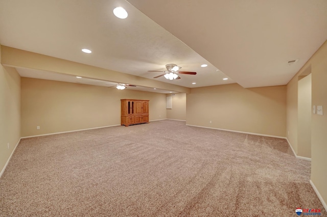 unfurnished living room with ceiling fan and carpet