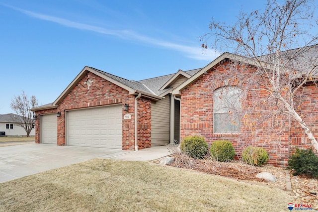 view of front of house with a garage and a front lawn