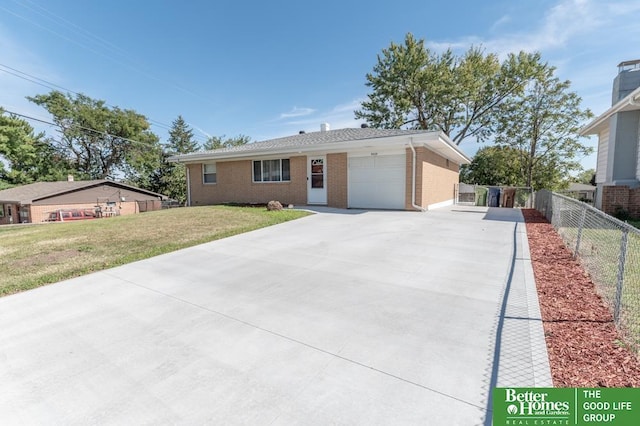 view of front of house with a garage and a front lawn