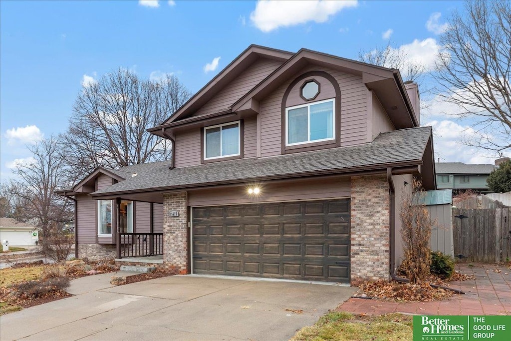 view of front of home with a porch and a garage