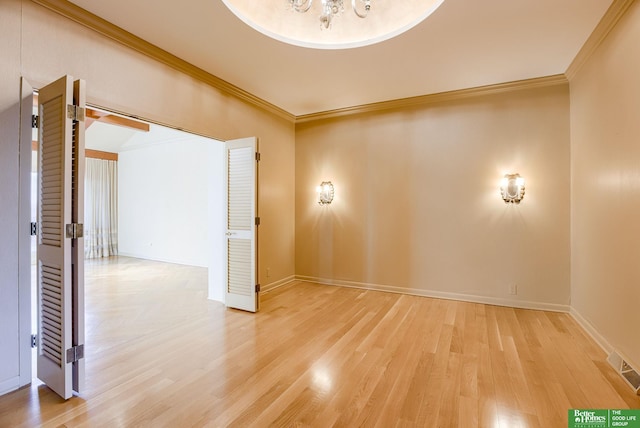 empty room featuring ornamental molding and wood-type flooring