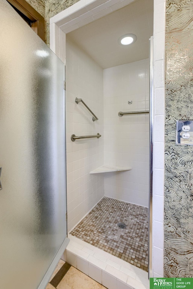 bathroom with tiled shower