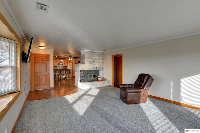 unfurnished living room with crown molding, ceiling fan, and wood-type flooring