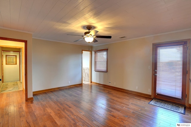 unfurnished room with wood-type flooring, ceiling fan, crown molding, and wood ceiling