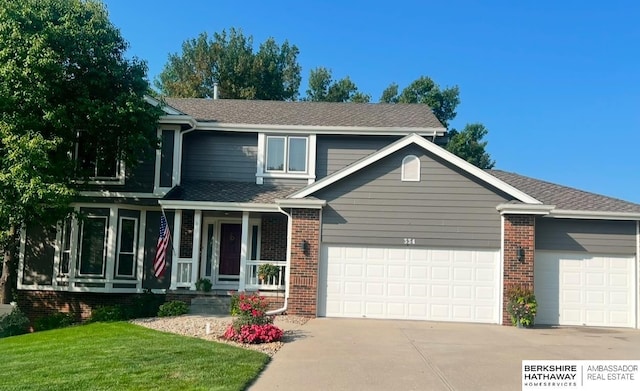 view of front of home with a garage and a front yard