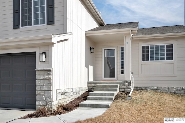 doorway to property featuring a garage