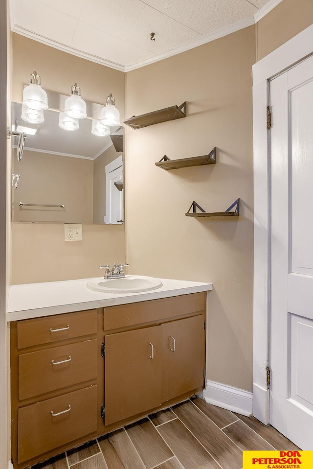 bathroom with vanity and crown molding