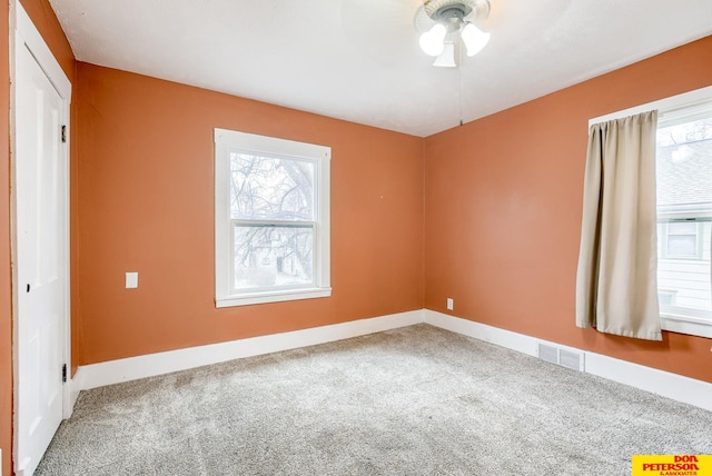 unfurnished room featuring carpet