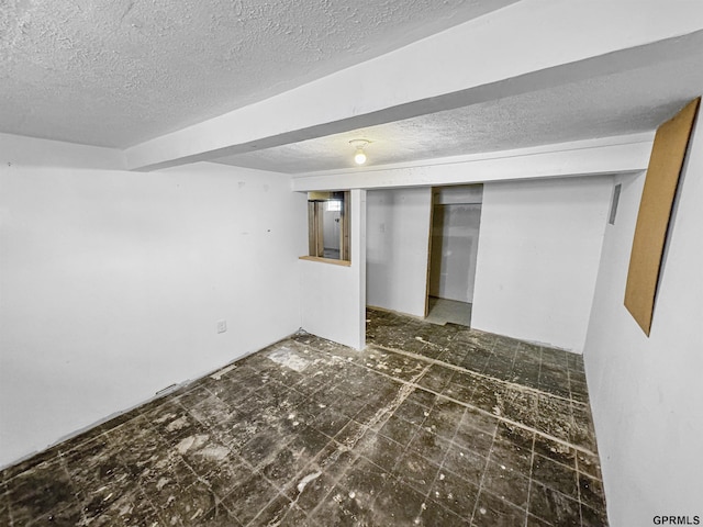 basement with a textured ceiling