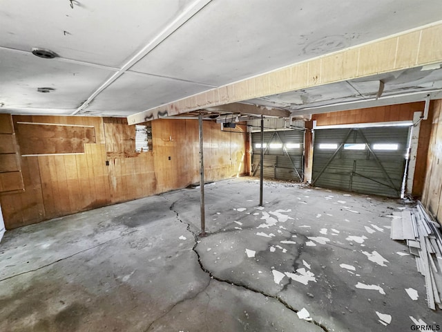 garage featuring wood walls