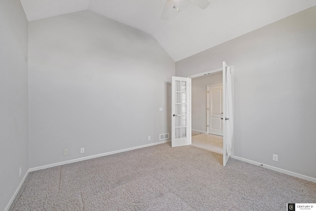 unfurnished bedroom featuring french doors, ceiling fan, lofted ceiling, and light carpet