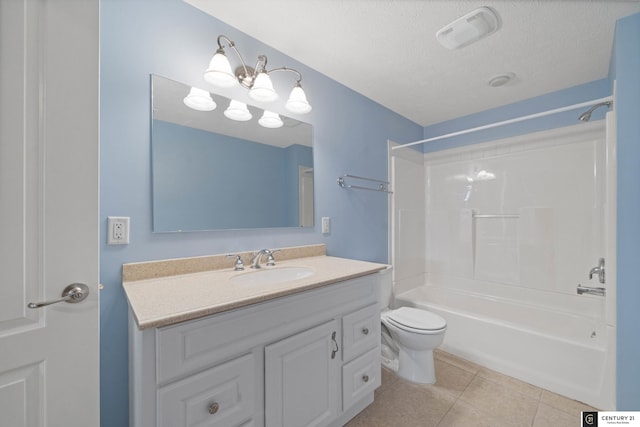 full bathroom with washtub / shower combination, tile patterned flooring, vanity, a textured ceiling, and toilet