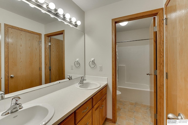 full bathroom with vanity, tub / shower combination, and toilet