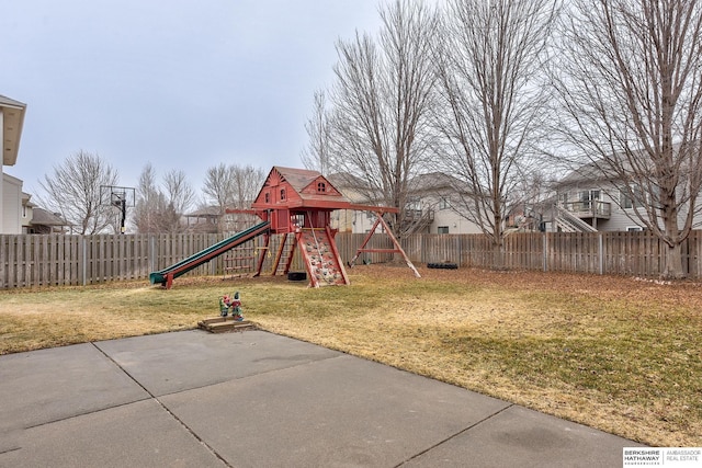 view of jungle gym featuring a yard and a patio