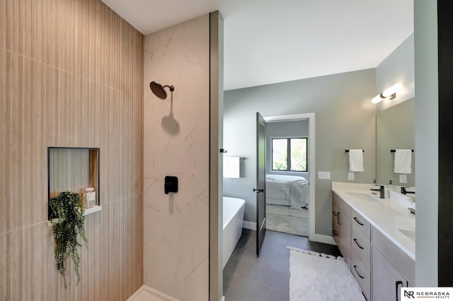 bathroom with vanity, tile patterned floors, and a bathtub