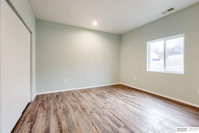 unfurnished bedroom featuring light wood-type flooring