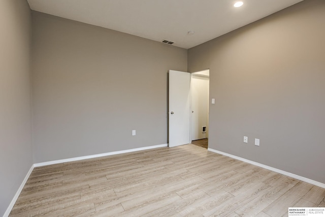 spare room featuring light hardwood / wood-style floors