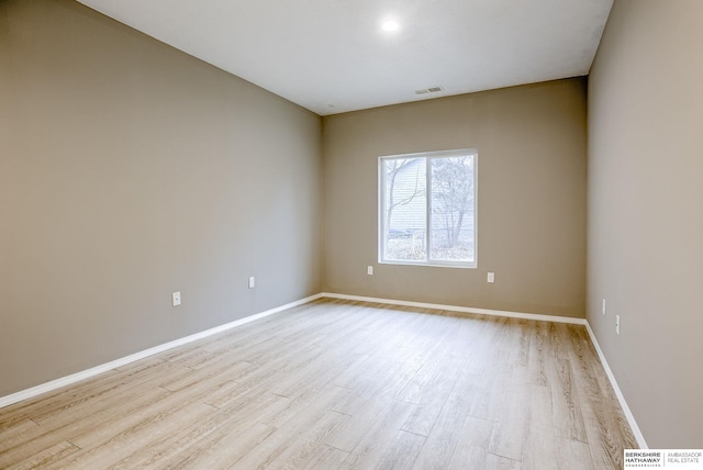 unfurnished room with light hardwood / wood-style flooring