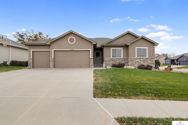 view of front of house featuring a garage and a front lawn