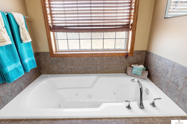 bathroom featuring a relaxing tiled tub