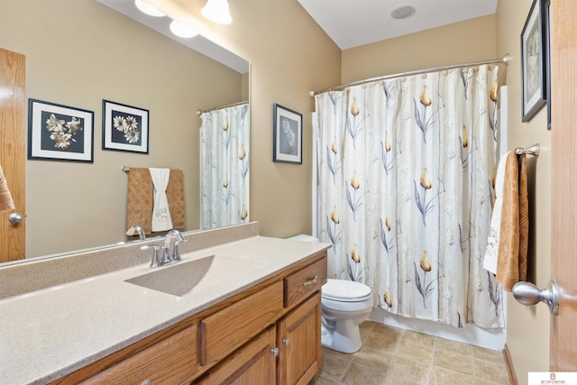 full bathroom with vanity, shower / bath combo, and toilet