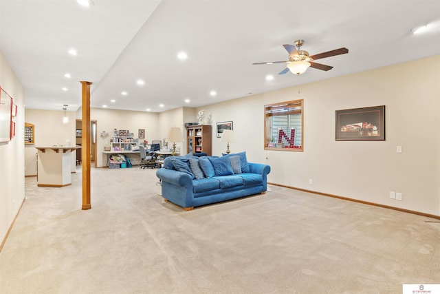 living room featuring ceiling fan and light colored carpet