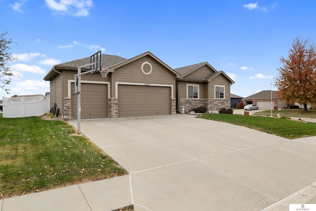 view of front of property featuring a garage and a front yard