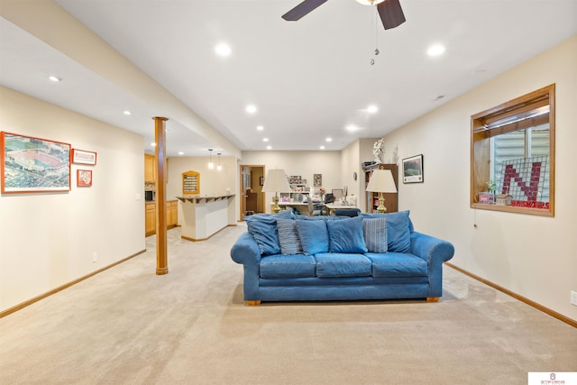 living room with light colored carpet and ceiling fan