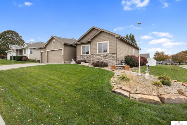 view of front of house with a garage and a front lawn