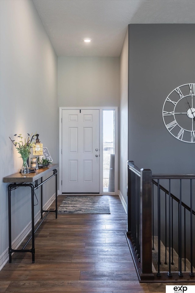 foyer with dark wood-type flooring