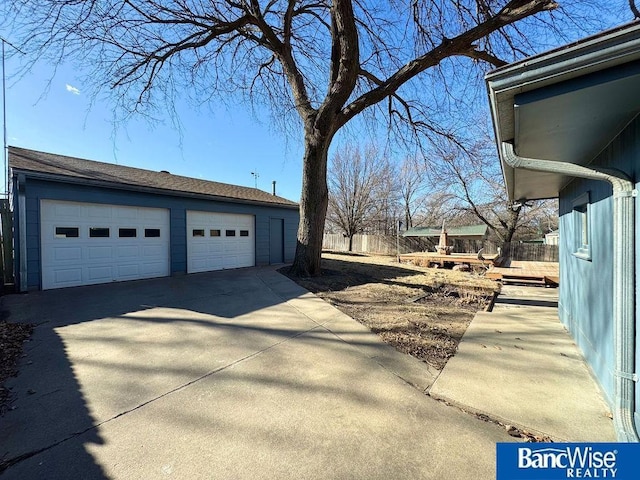 view of side of property with an outbuilding and a garage