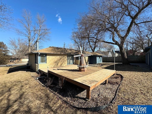 back of property featuring a wooden deck and central AC