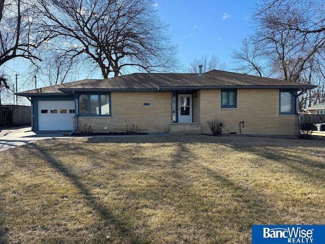 single story home with a garage and a front yard