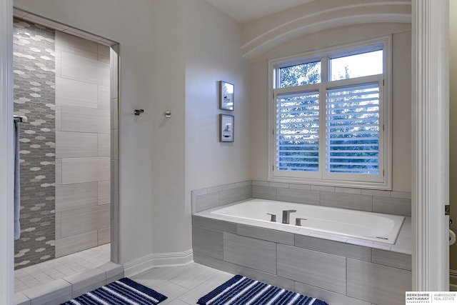 bathroom with tile patterned flooring and plus walk in shower