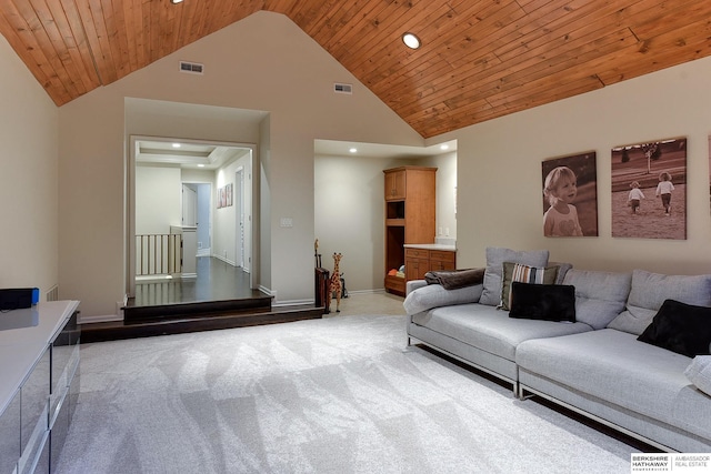 carpeted living room featuring wood ceiling and high vaulted ceiling